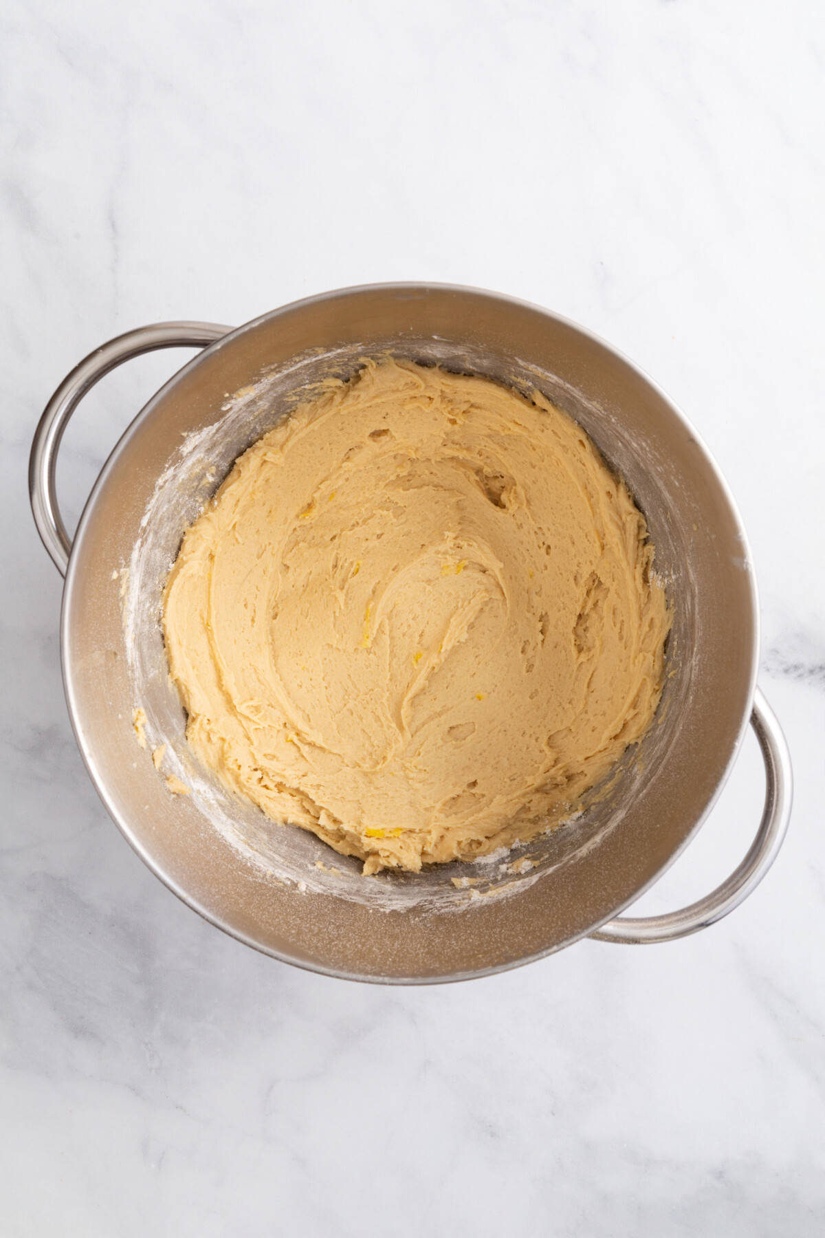 stainless steel mixing bowl with regular cookie dough batter.