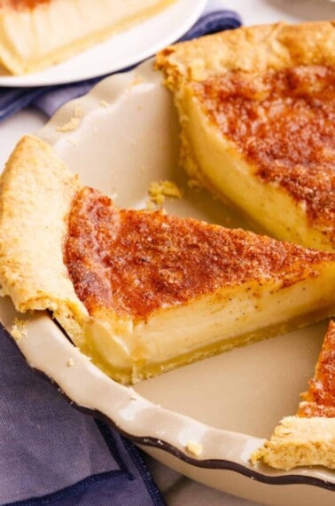 A slice of Amish sugar cream pie in a pie tin.