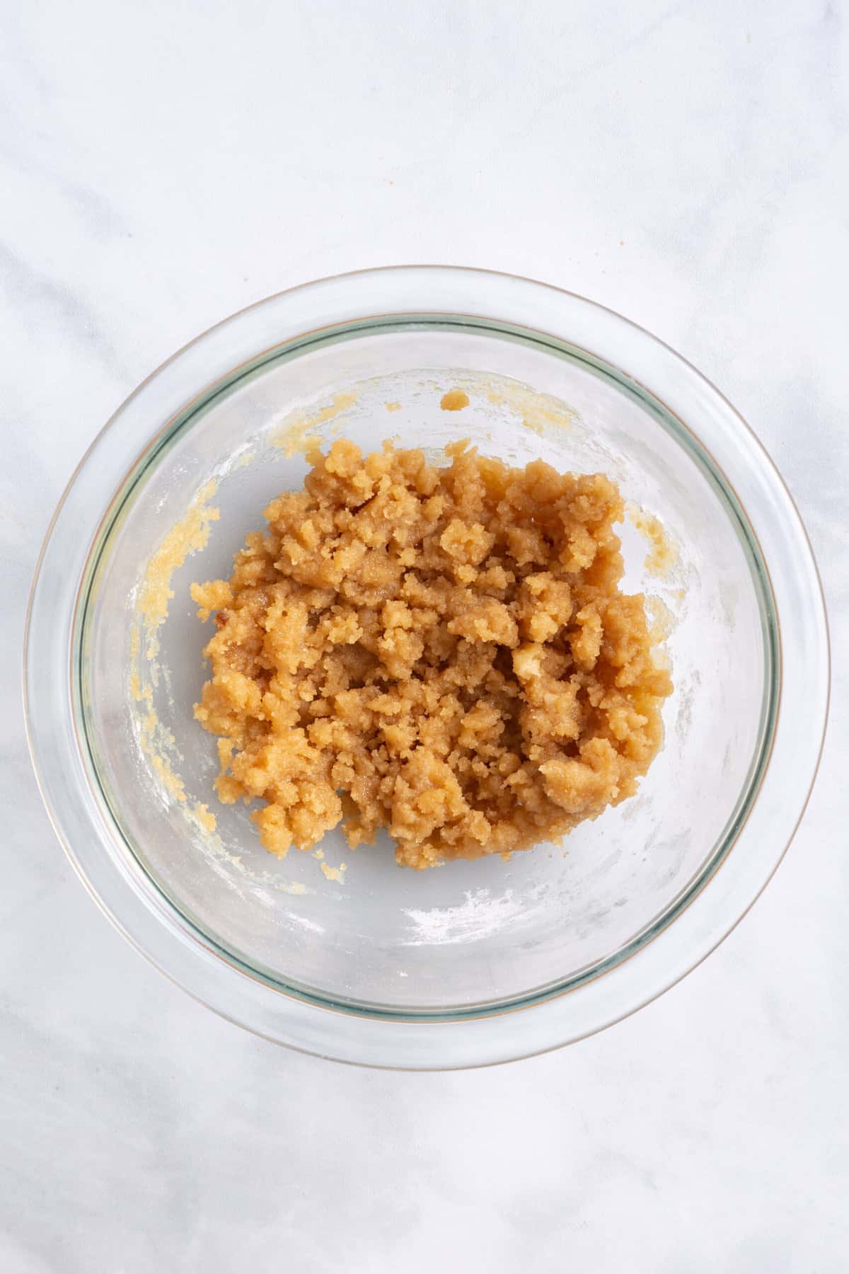 pumpkin apple muffin crumble topping mixture in a large glass bowl