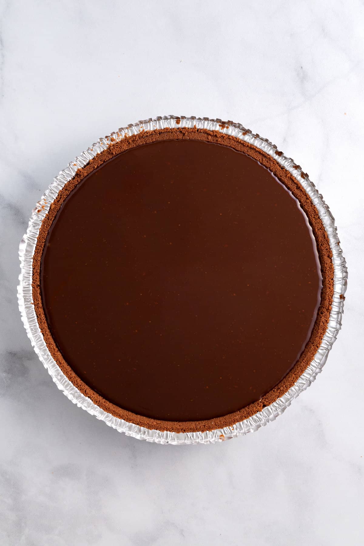 store-bought chocolate pie crust with peanut butter filling and chocolate ganache.