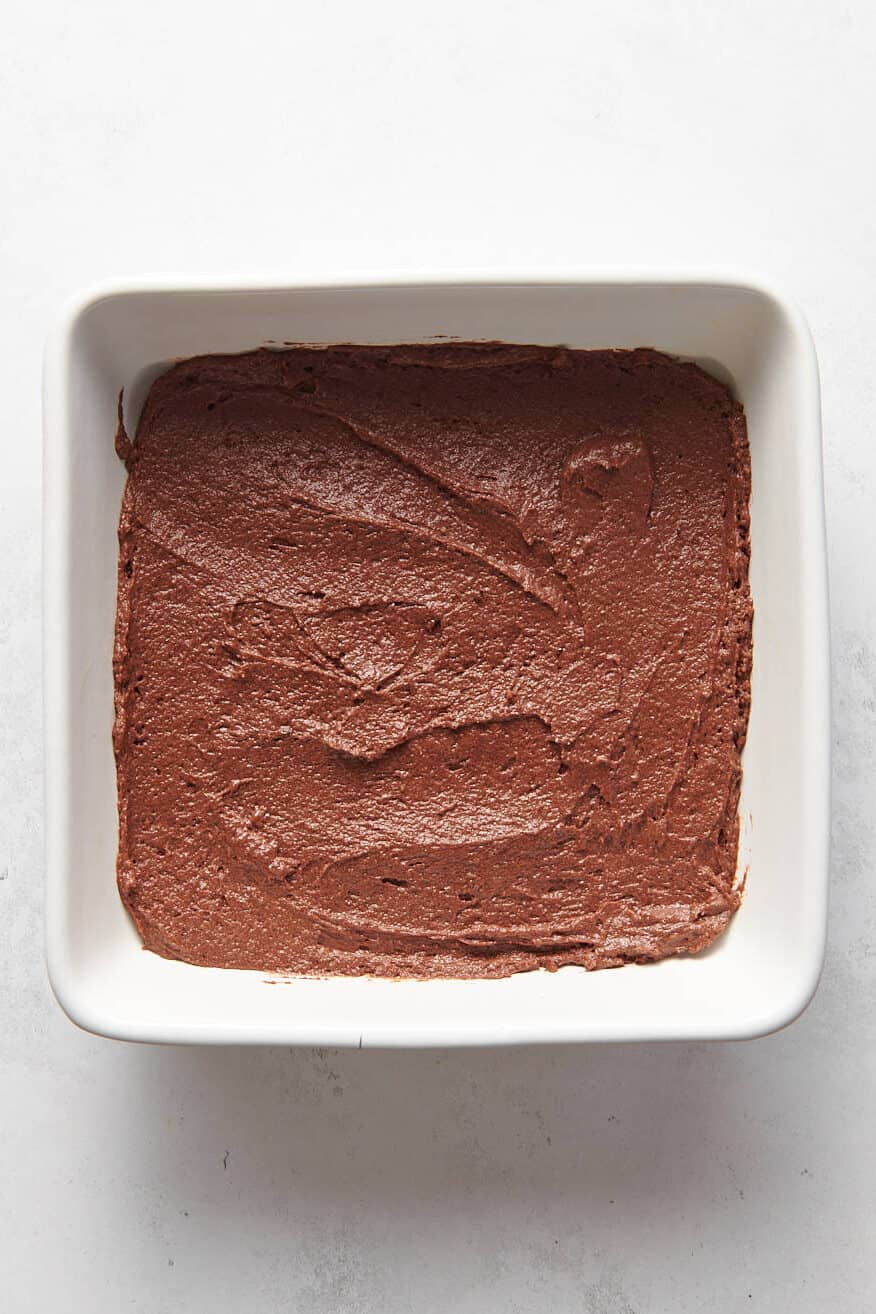 chocolate box cake batter prepped in an 8x8 baking dish.