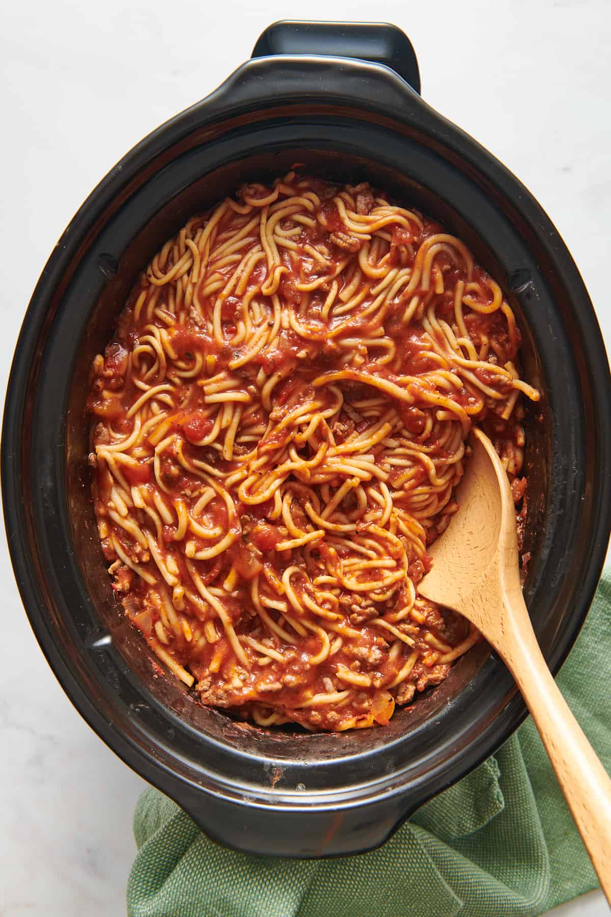 top down image of crock pot spaghetti. 