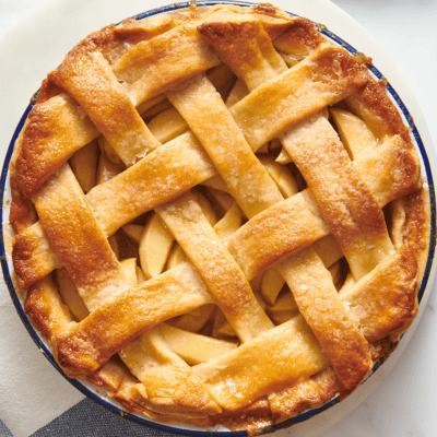 Overhead image of a Granny Smith apple pie with a lattice crust.