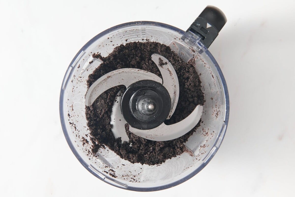 Oreo crumbs in food processor.