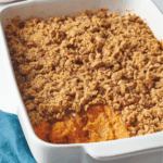 A baking dish full of Paula Deen sweet potato casserole.