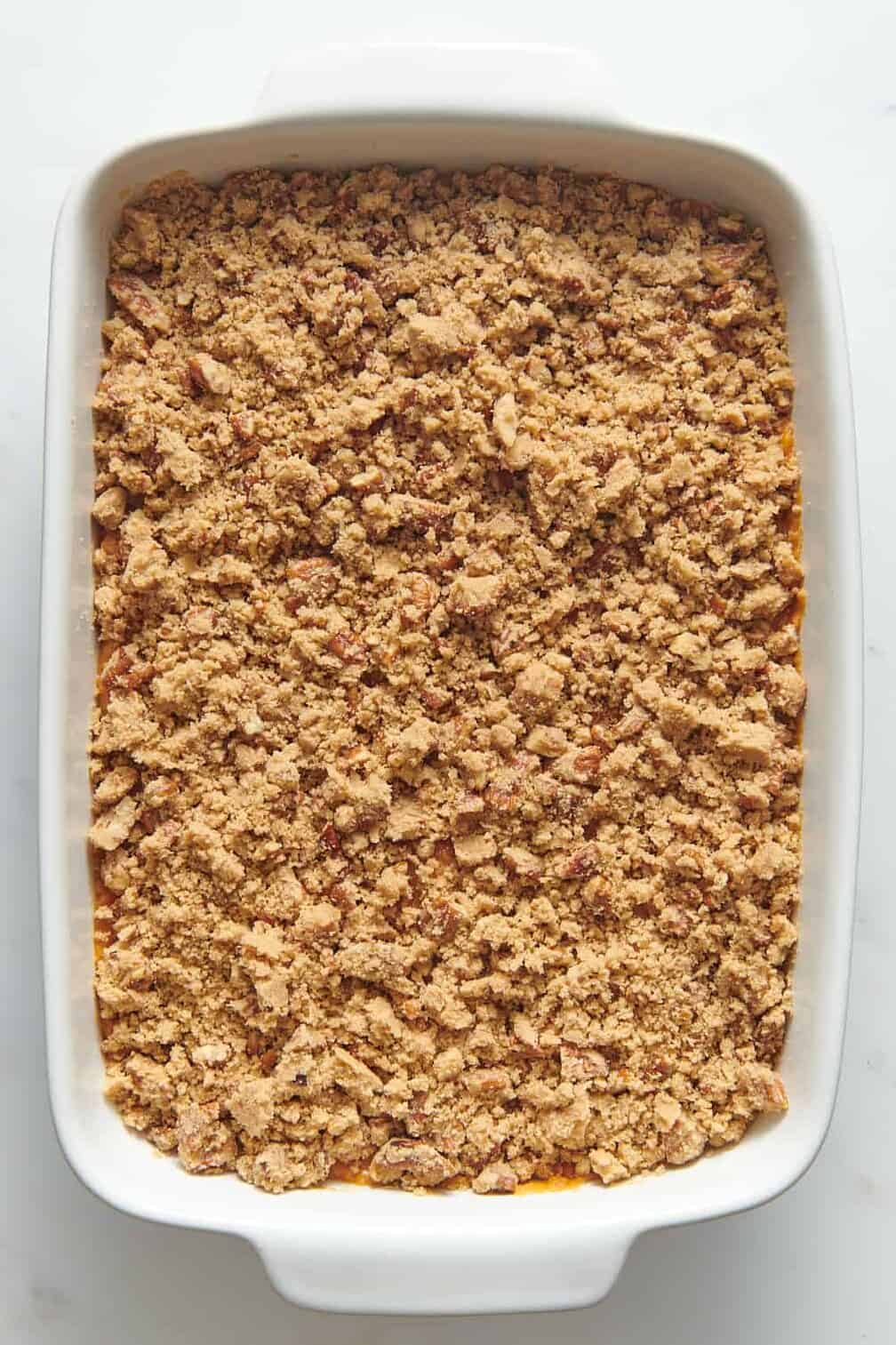 9x13 casserole dish with sweet potato casserole filling and strussel topping.