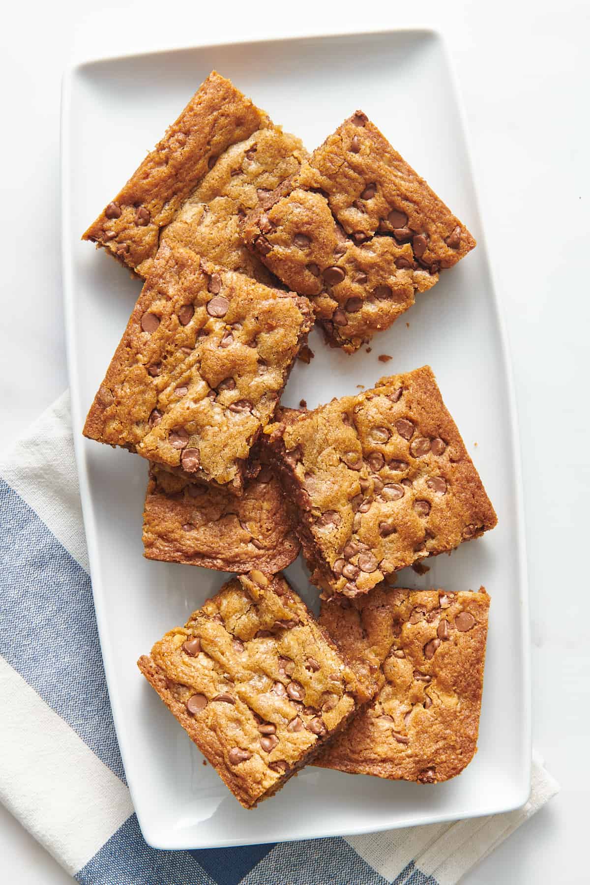 top down image of a plate of toll house chocolate chip cookie bars.