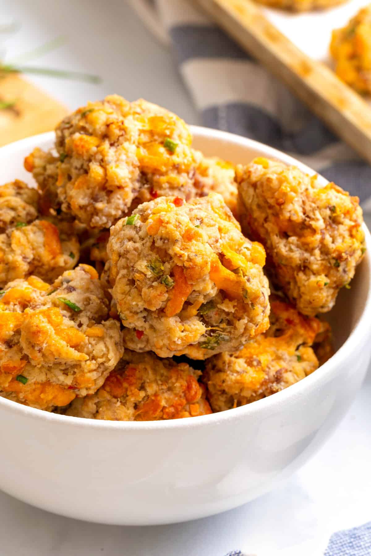 A bowl of cream cheese sausage balls.