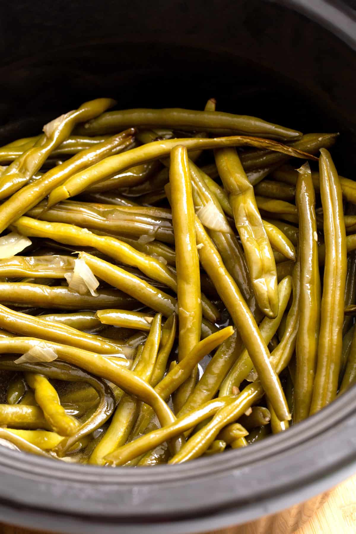 close up image of slow cooker green beans. 