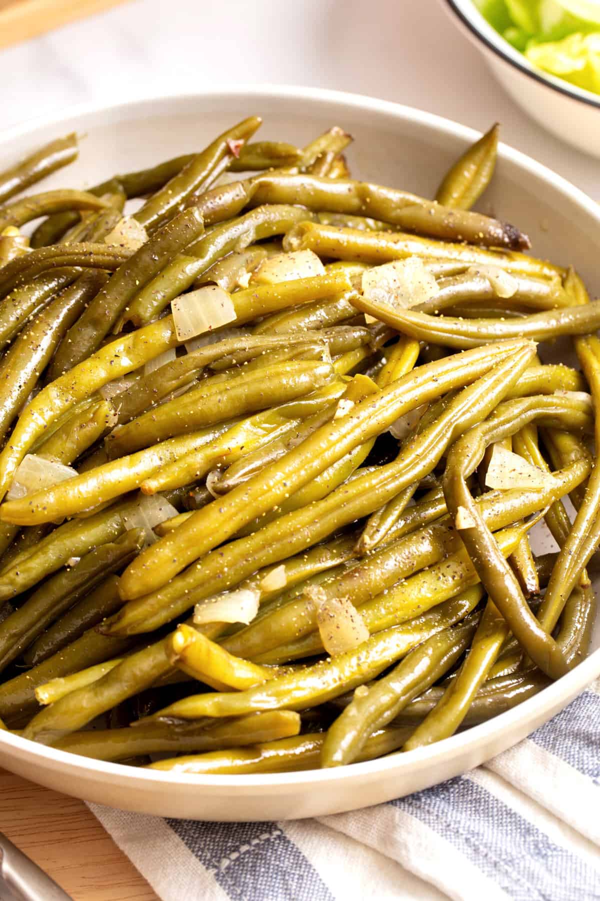 close up image of a plate of slow cooker green beans. 