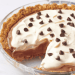 Chocolate pudding pie with a slice missing.