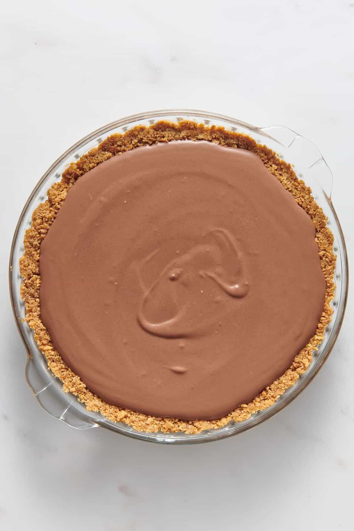 chocolate pudding filling pour into a graham cracker crust prepared pie dish. 