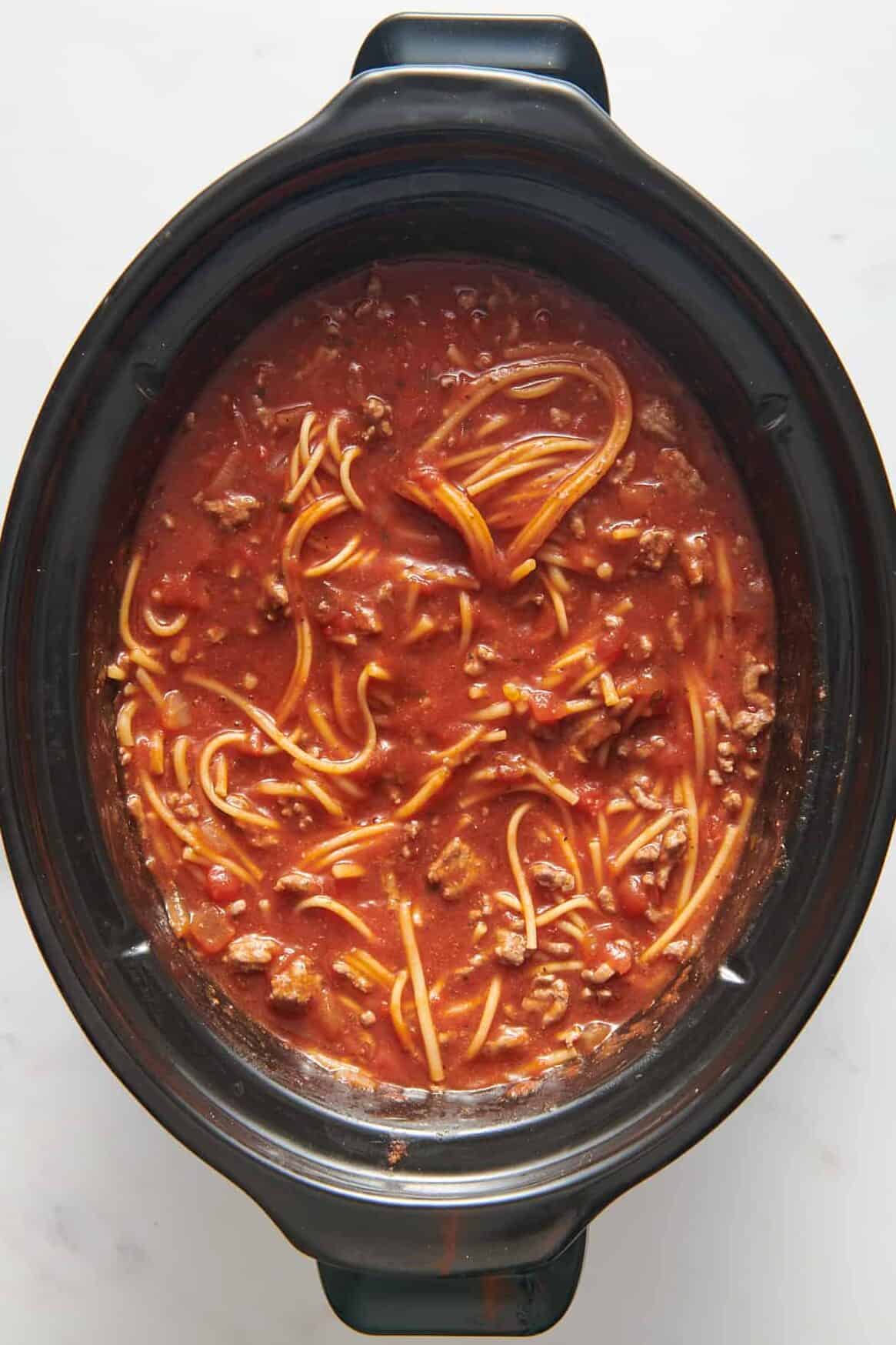 top down image of crock pot spaghetti. 