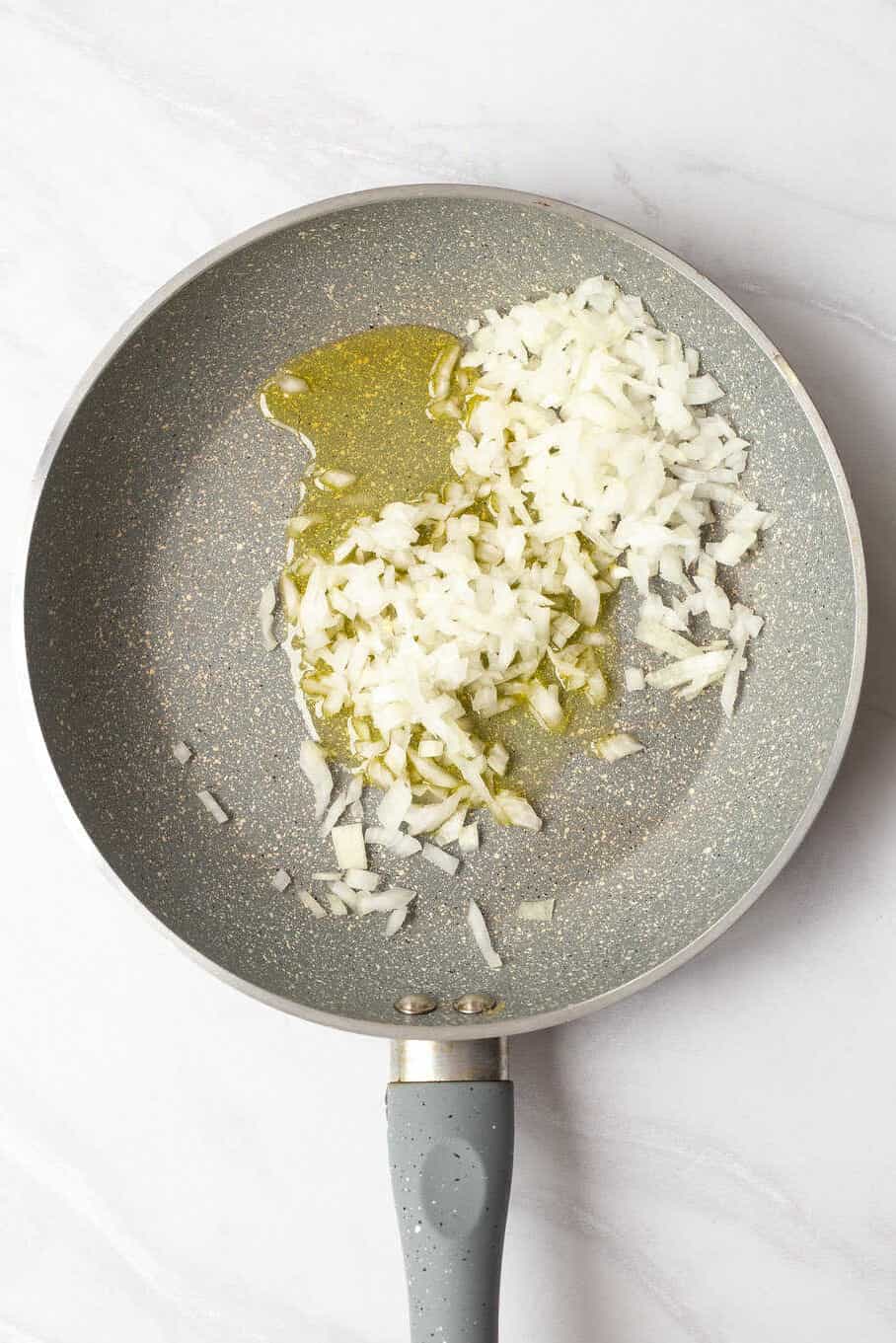 skillet with olive oil and diced onions. 