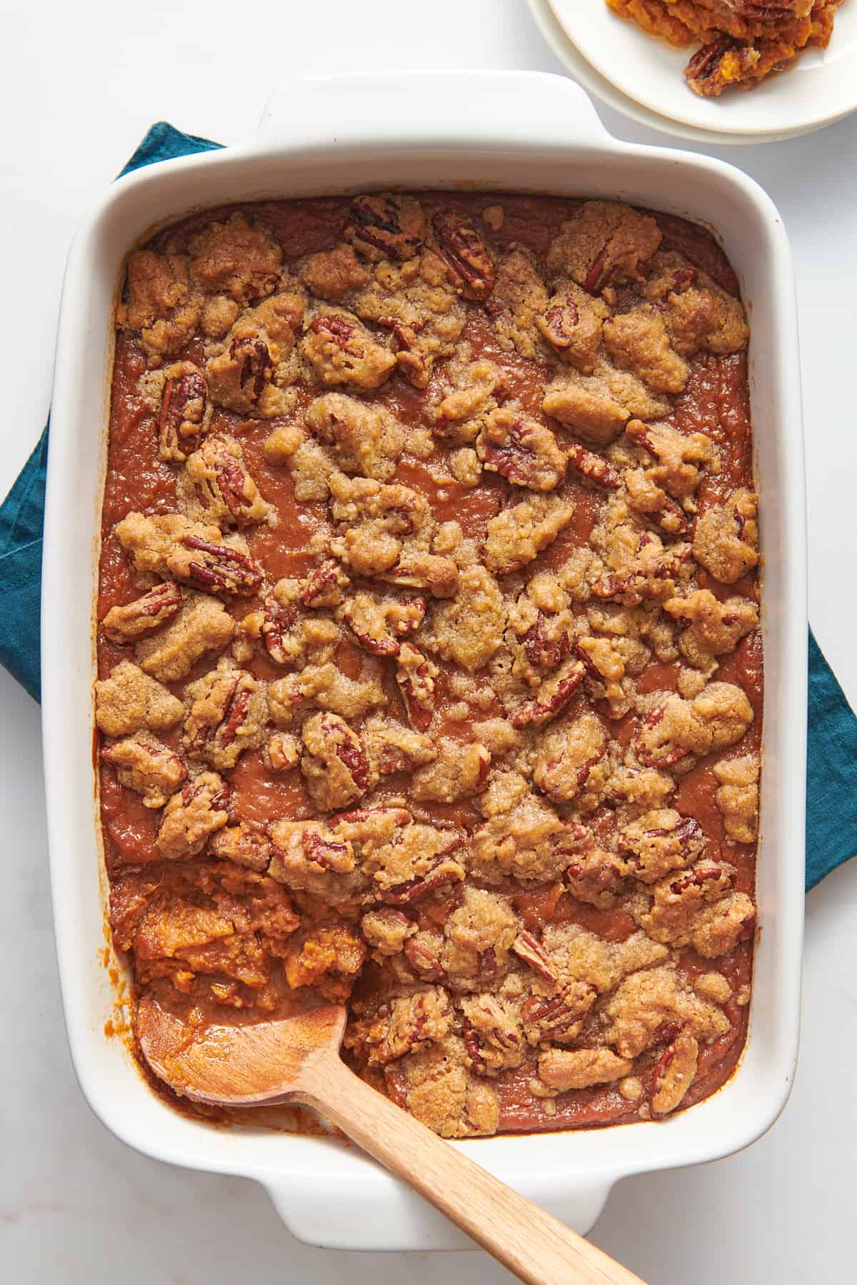 top down image of sweet potato souffle sitting in a 9x13 casserole dish. 