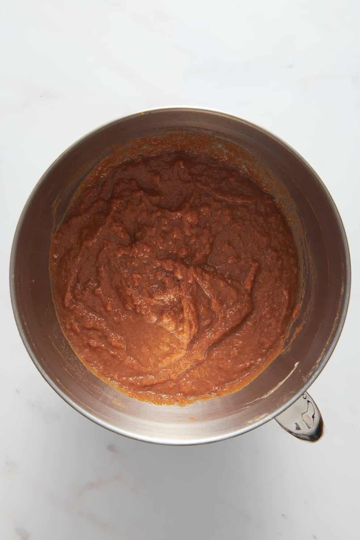 sweet potato souffle filling in a stainless steel mixing bowl. 