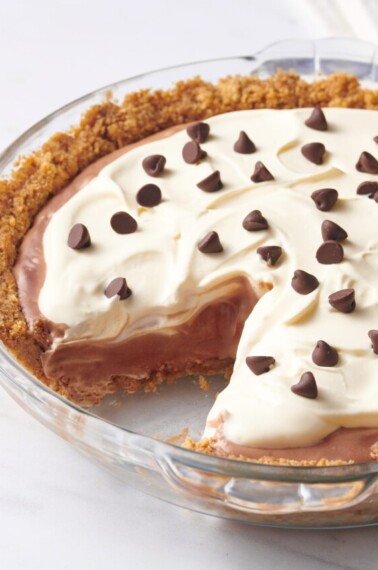 Chocolate pudding pie with a slice missing.