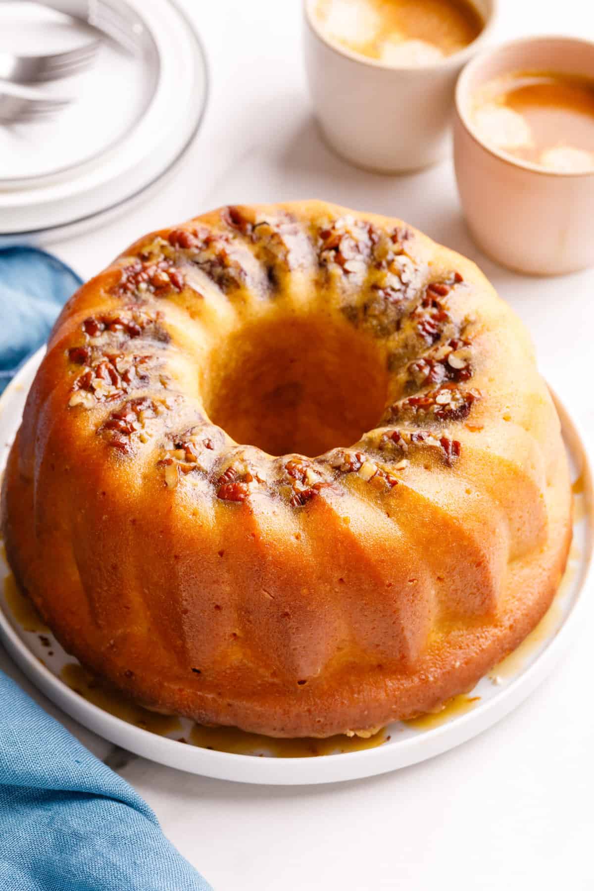 Cake Mix Rum Bundt Cake served on a white round plate. 