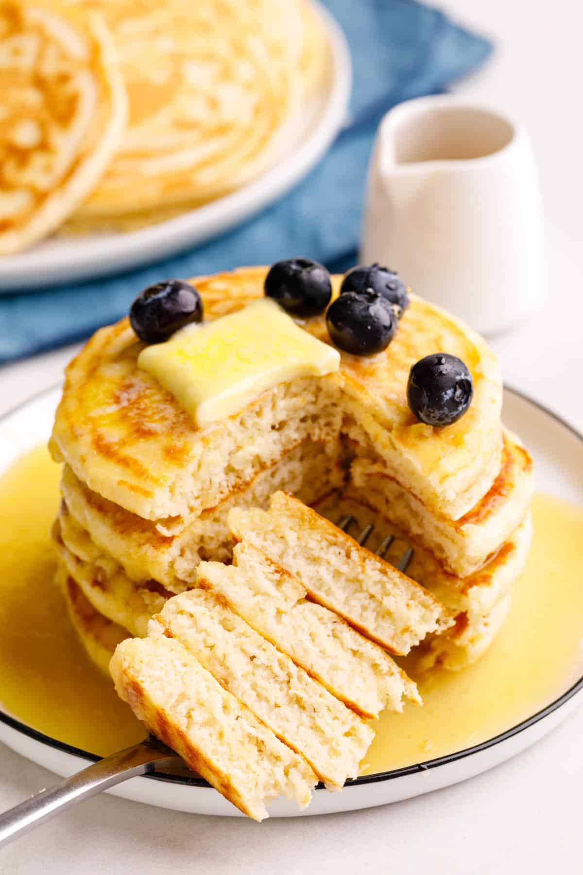 stack of four classic bisquick pancake cut to show the cross section. 