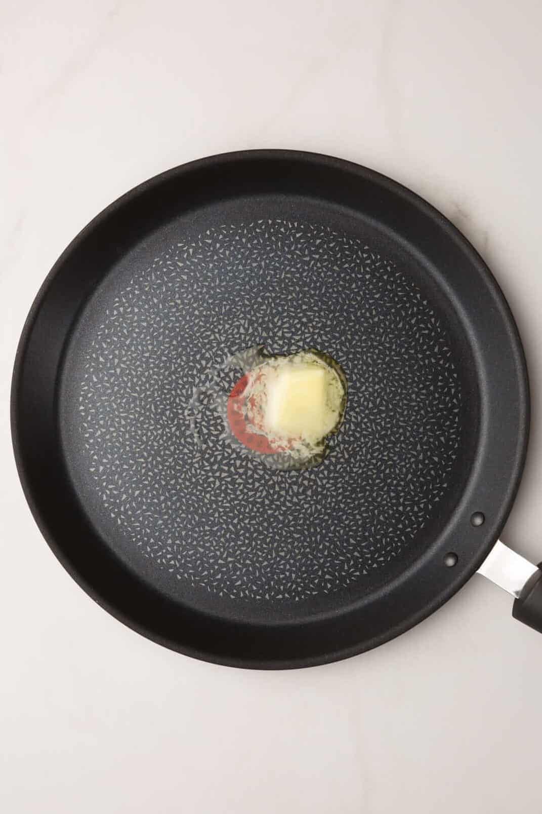 large skillet with melted butter.