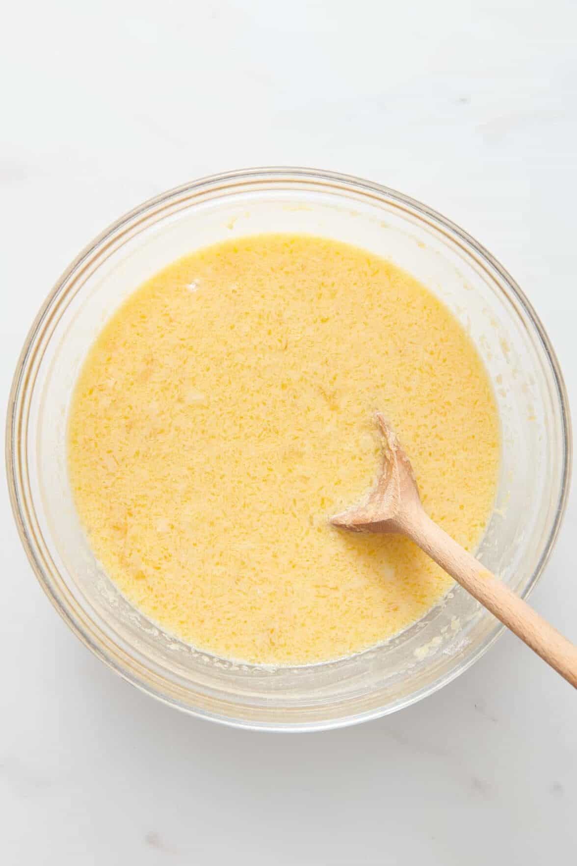 old fashioned coconut pie filling in a large glass mixing bowl. 