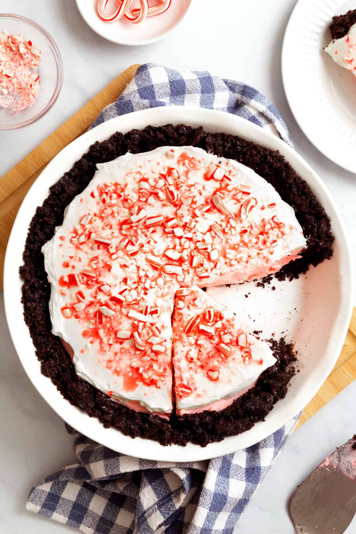 top down image of candy cane pie with a slice taken out. 