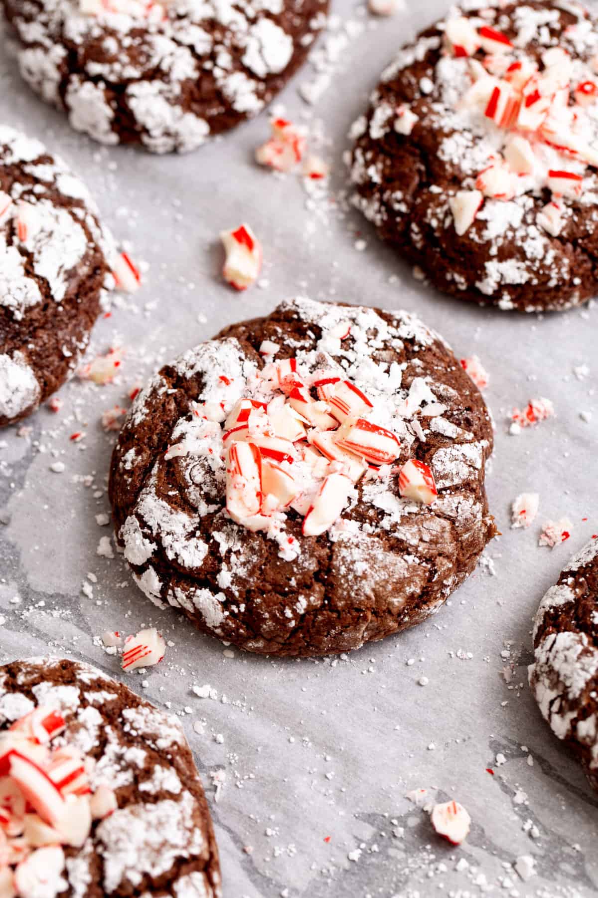 close up image of chocolate mint crinkle cookies. 