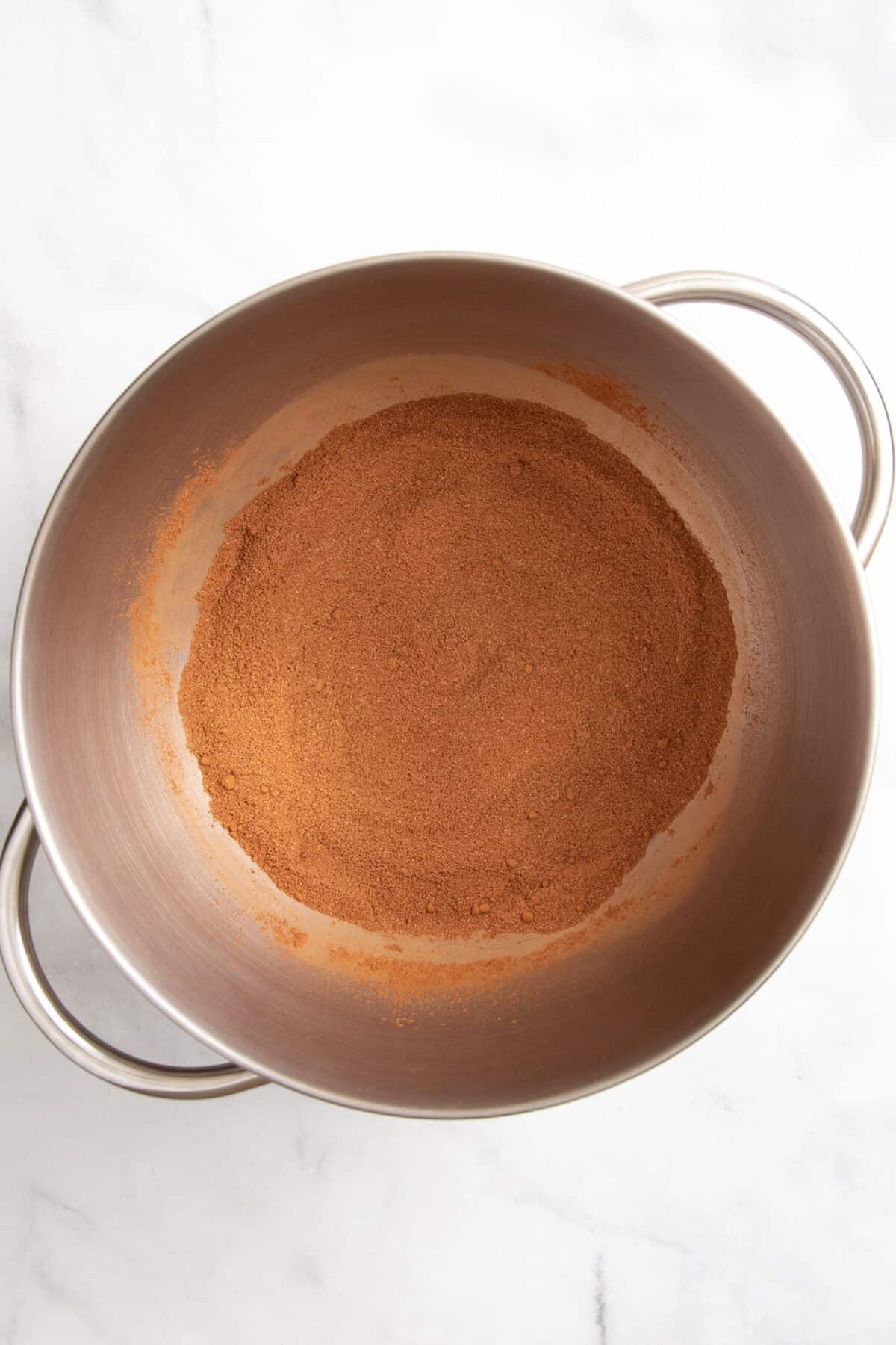 stainless steel mixing bowl with chocolate cocoa powder. 