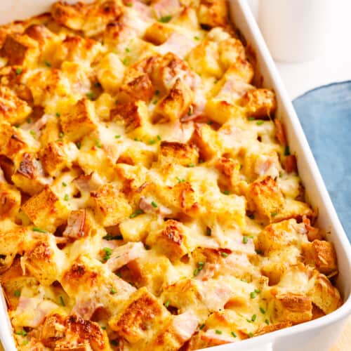 A dish of baked Eggs Benedict casserole.