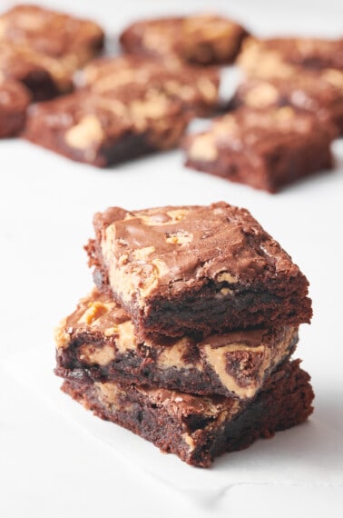 Three peanut butter swirl brownies on top of each other.