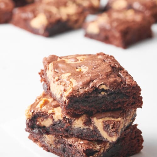 Three peanut butter swirl brownies on top of each other.