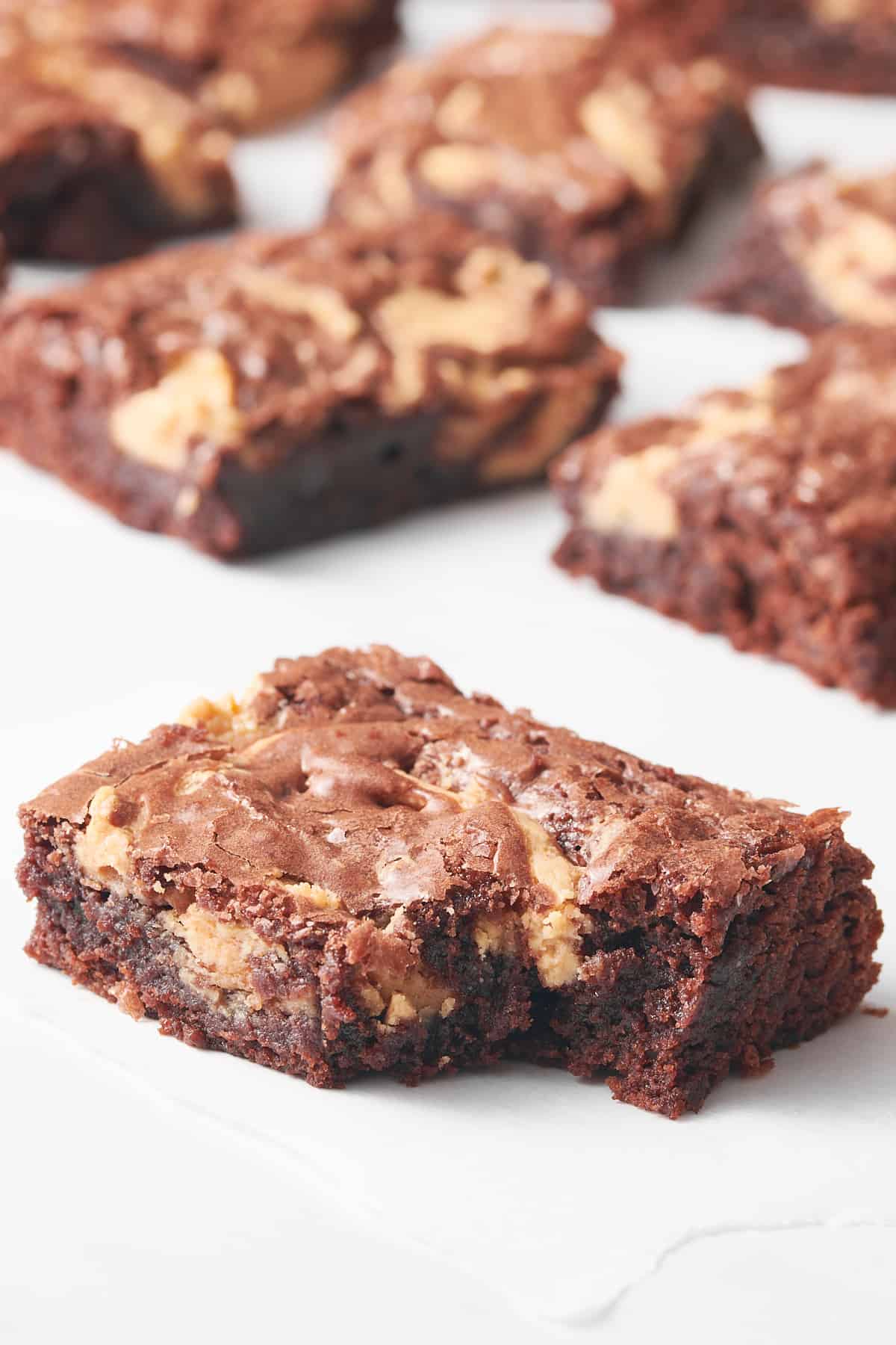 close up image of a peanut butter brownie with a bite taken out of it.