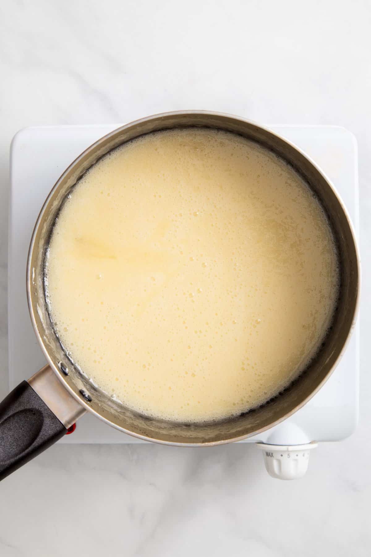 melted butter and marshmallows in a stovetop pan.