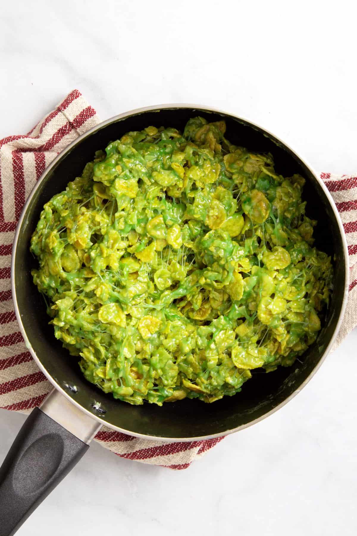 cornflakes coated in melted green-dyed marshmallow and butter mixture.