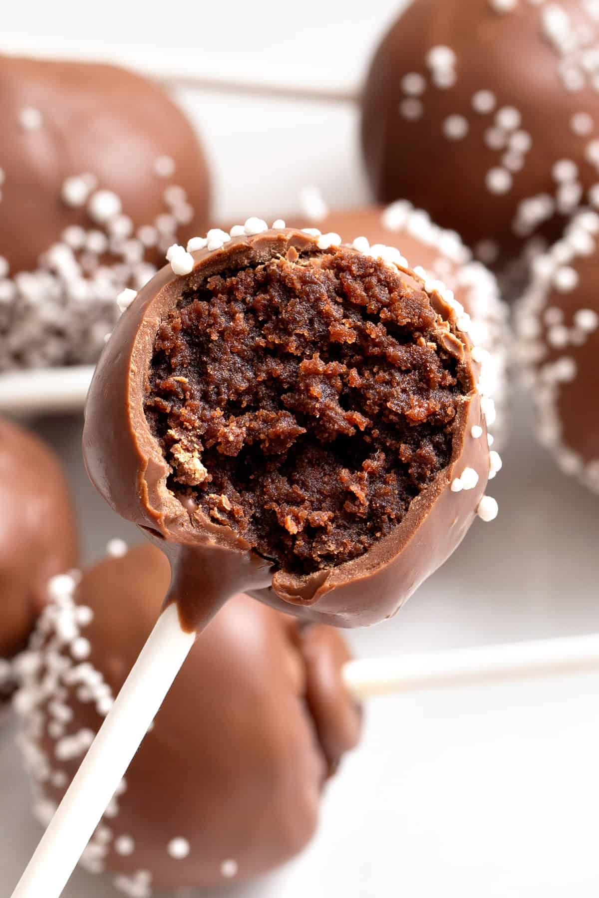 close up image of the cross section of a starbucks chocolate cake pop. 