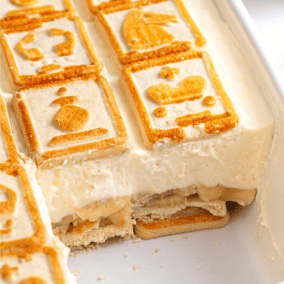 Chessman banana pudding in a baking dish with servings missing.