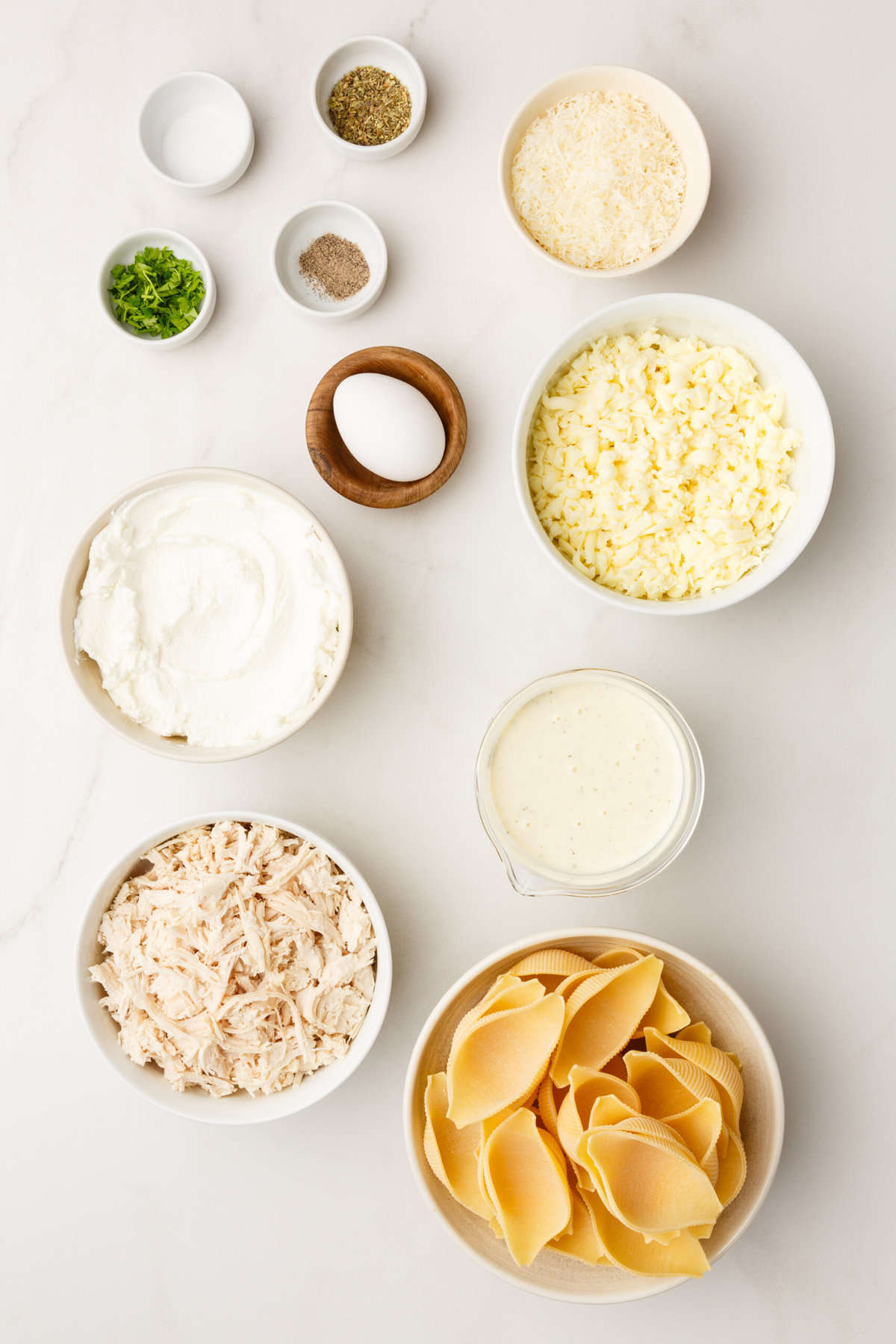 ingredients to make chicken alfredo stuffed shells. 