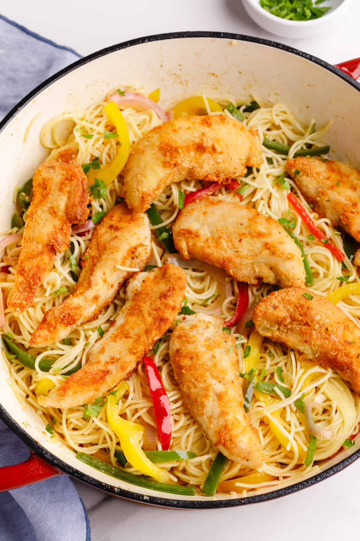 close up image of a large dutch oven pot with olive garden chicken scampi. 