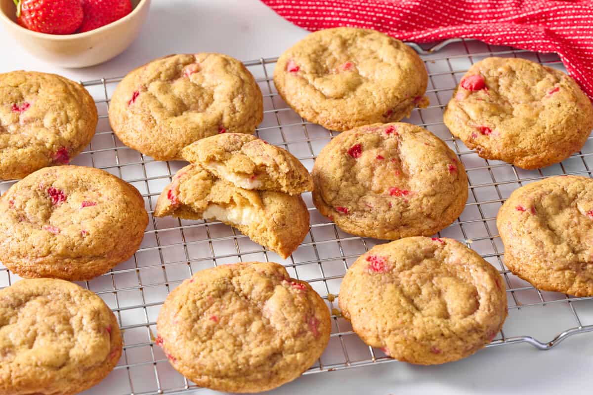 Strawberry cheesecake cookies on cooling rack.