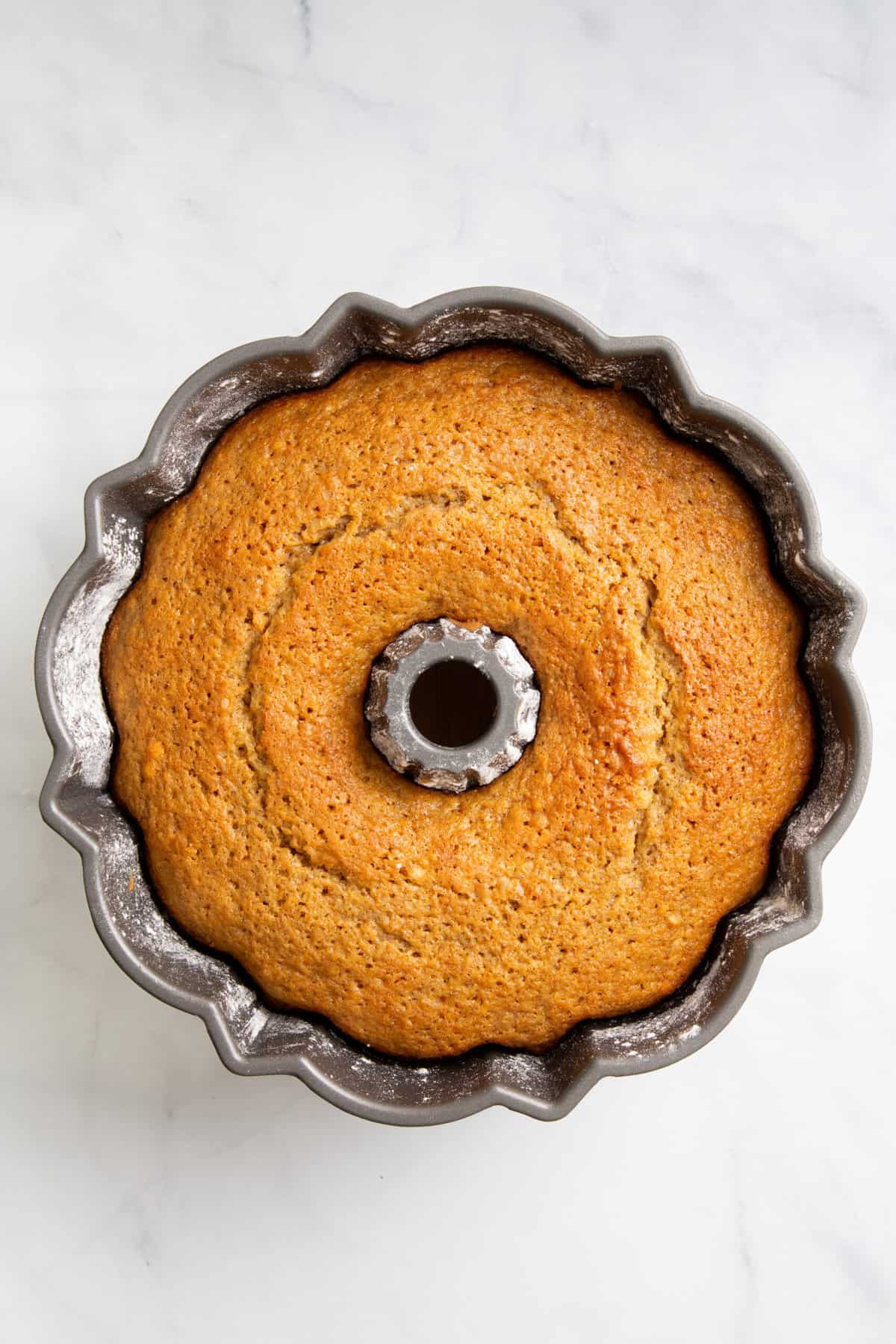 top down image of crack cake baked in a bundt cake tin. 