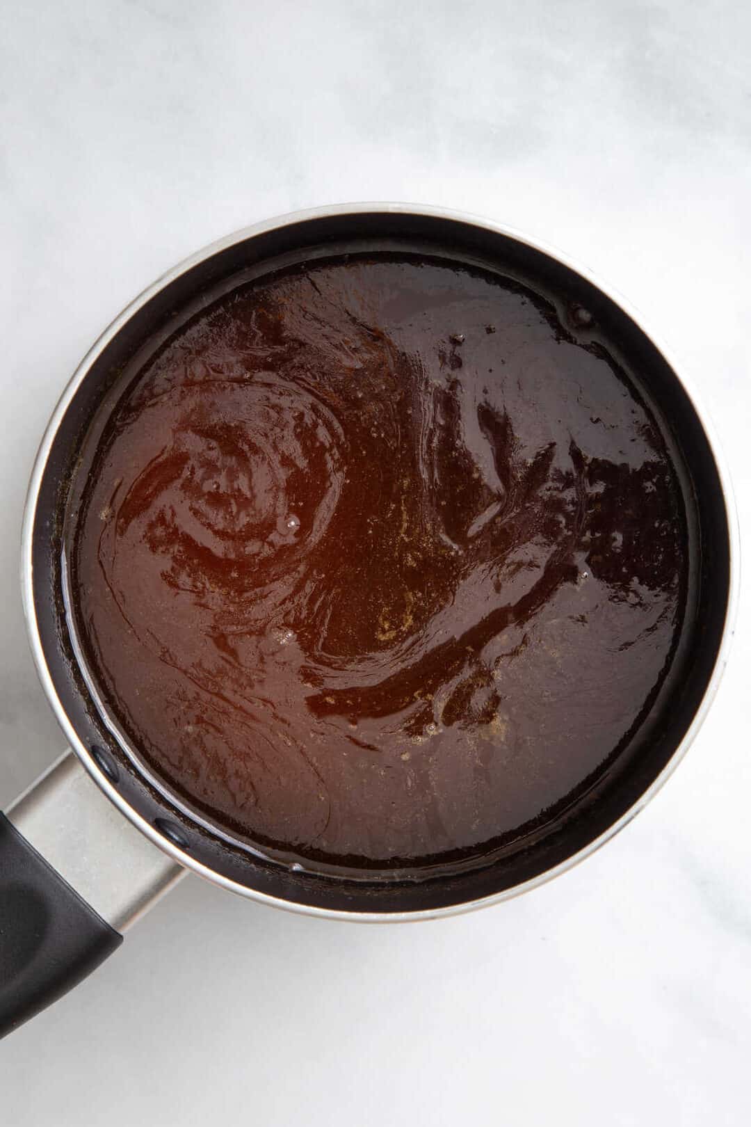 top down image of a sauce pan with brown sugar glaze.