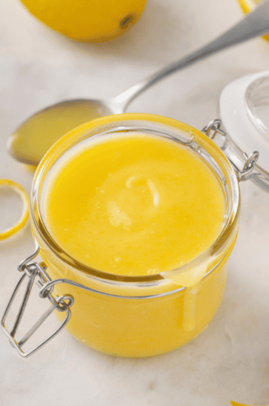 A glass jar of homemade lemon curd.