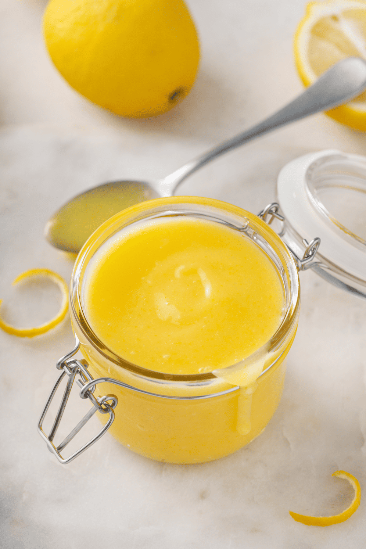 glass jar of homemade lemon curd. 