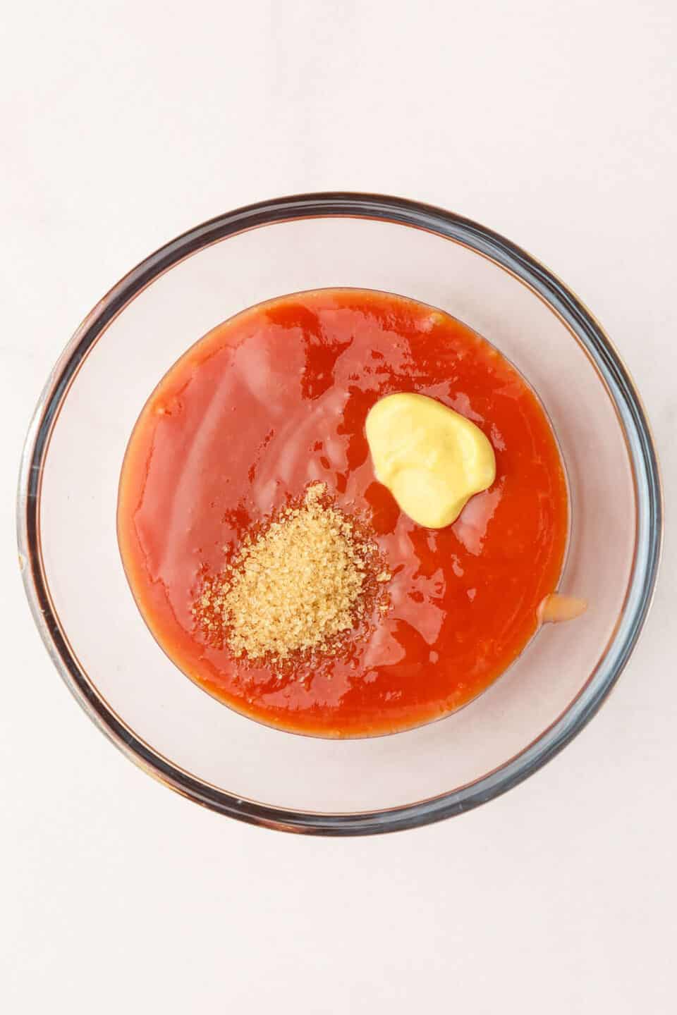 meatloaf ketchup sauce mixture in a large glass bowl.