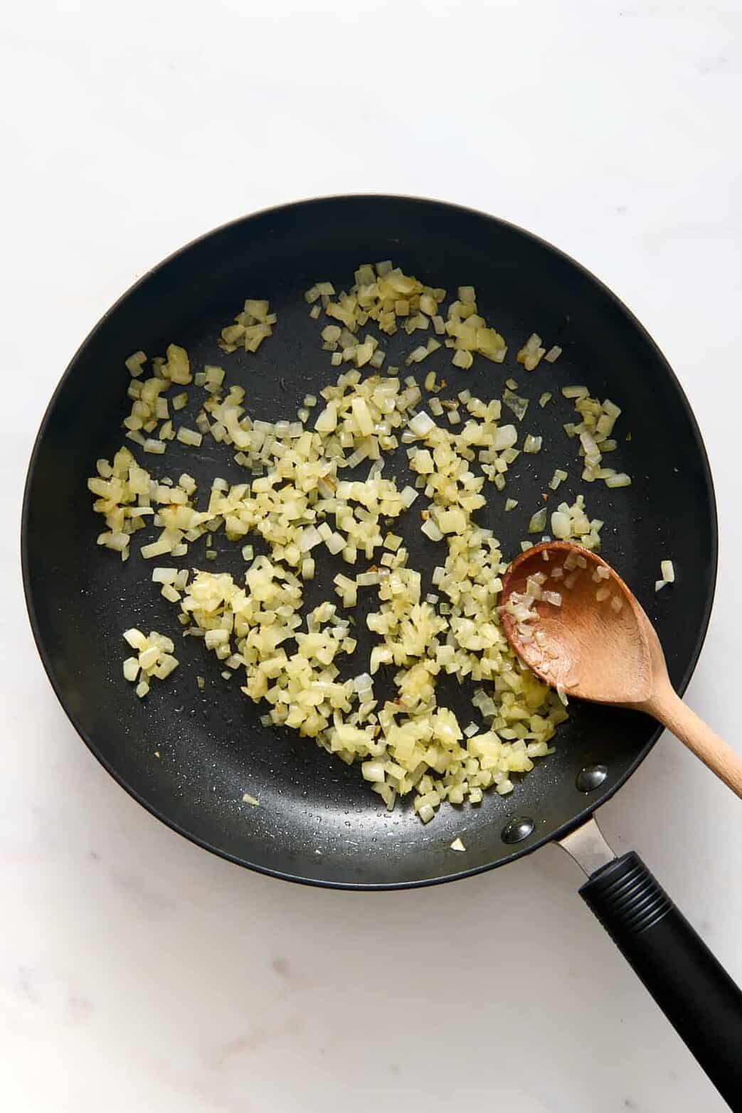 large skillet with minced garlic.