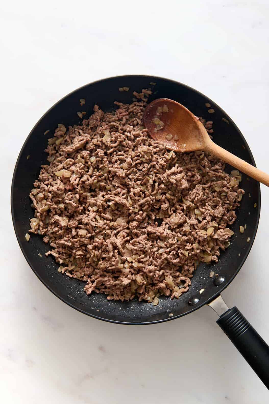 large skilled with cooked ground beef.