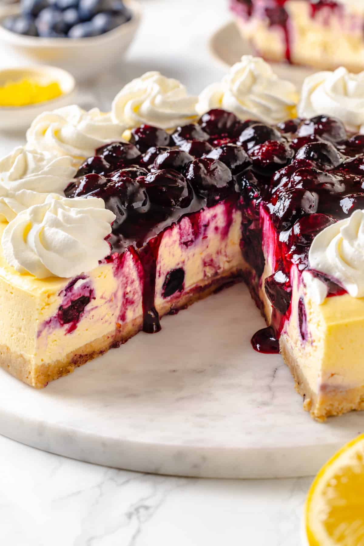cross section of a lemon blueberry cheesecake. 
