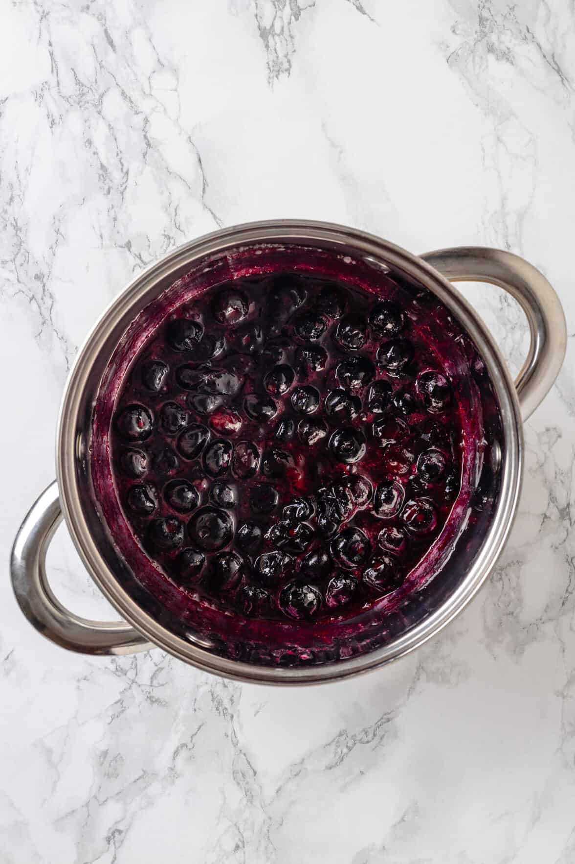 top down image of homemade blueberry jam topping for Lemon Blueberry Cheesecake.