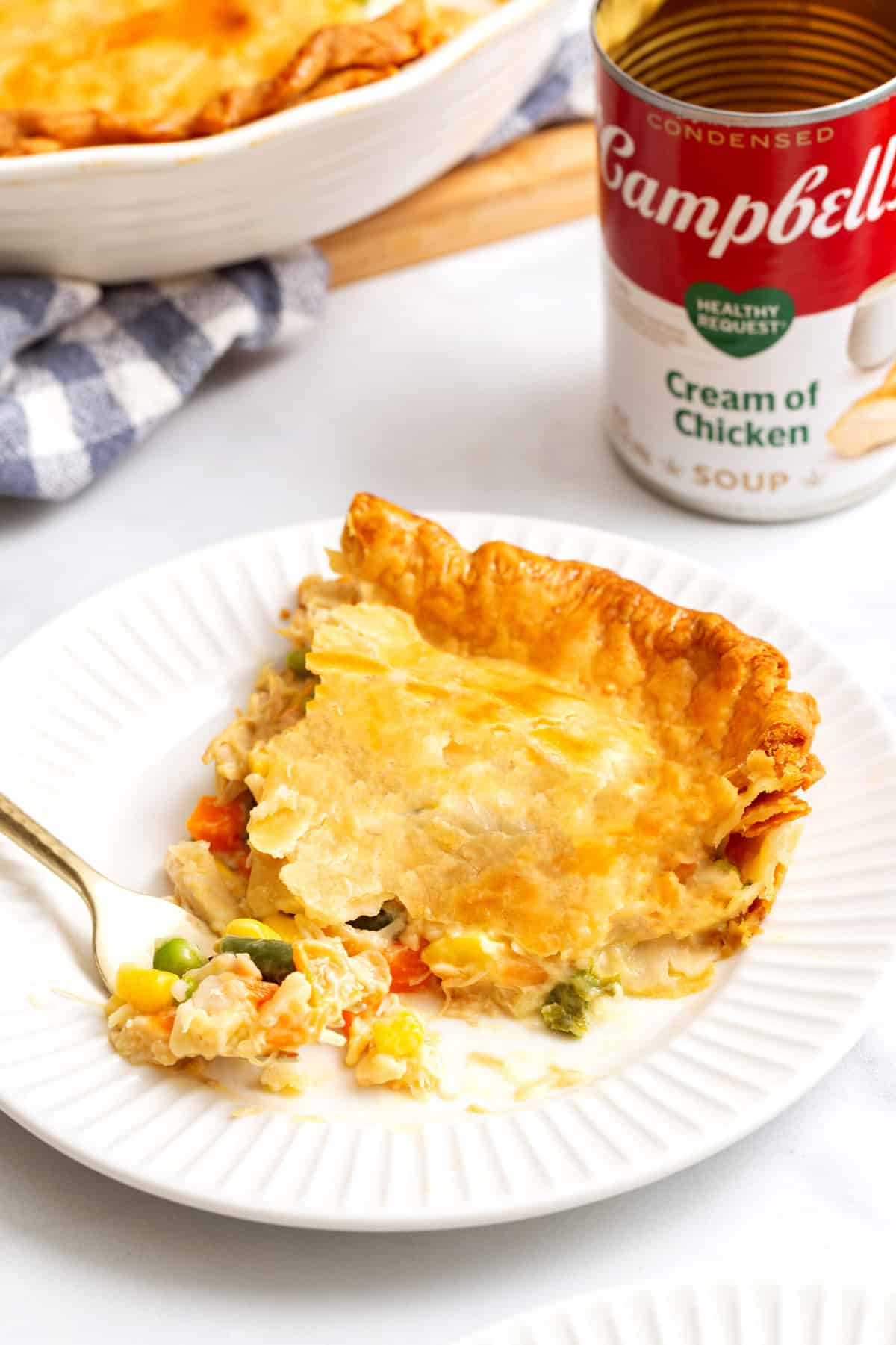 slice of campbell's chicken pot pie served on a white round plate.