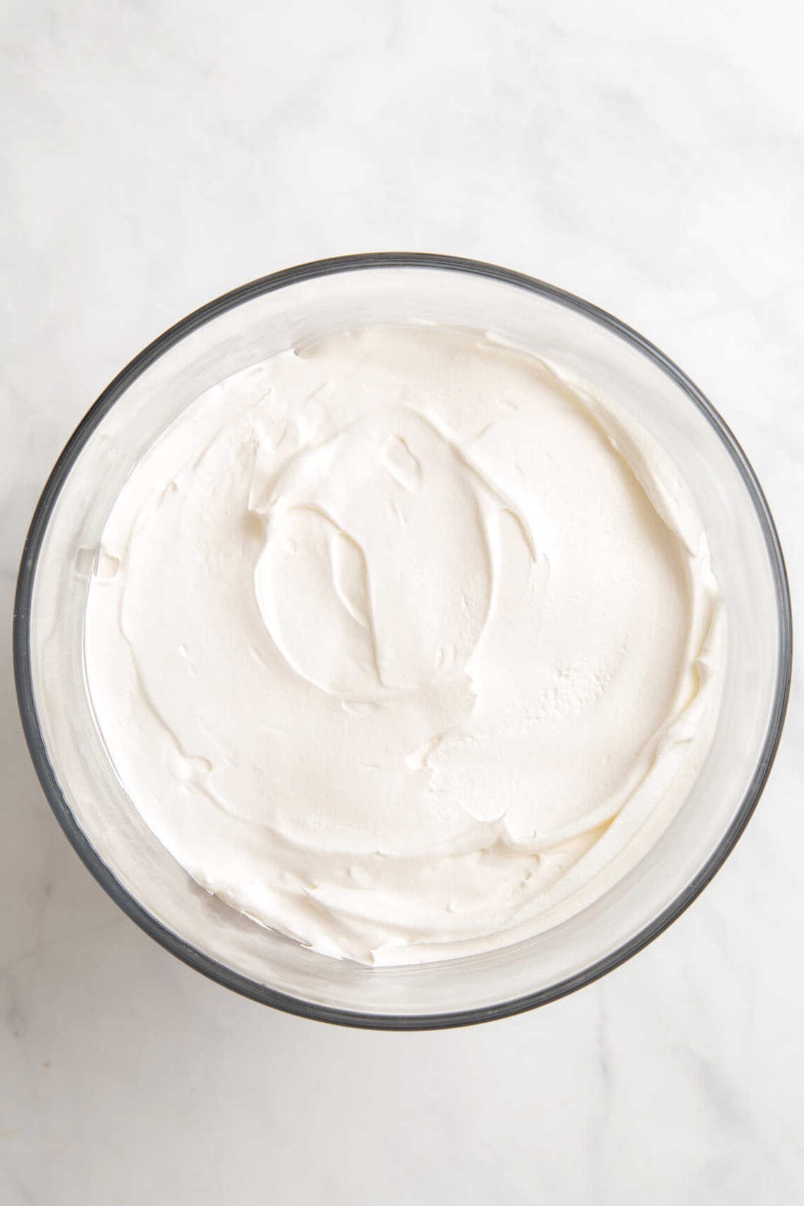top down image of a large glass trifle of cool whip. 